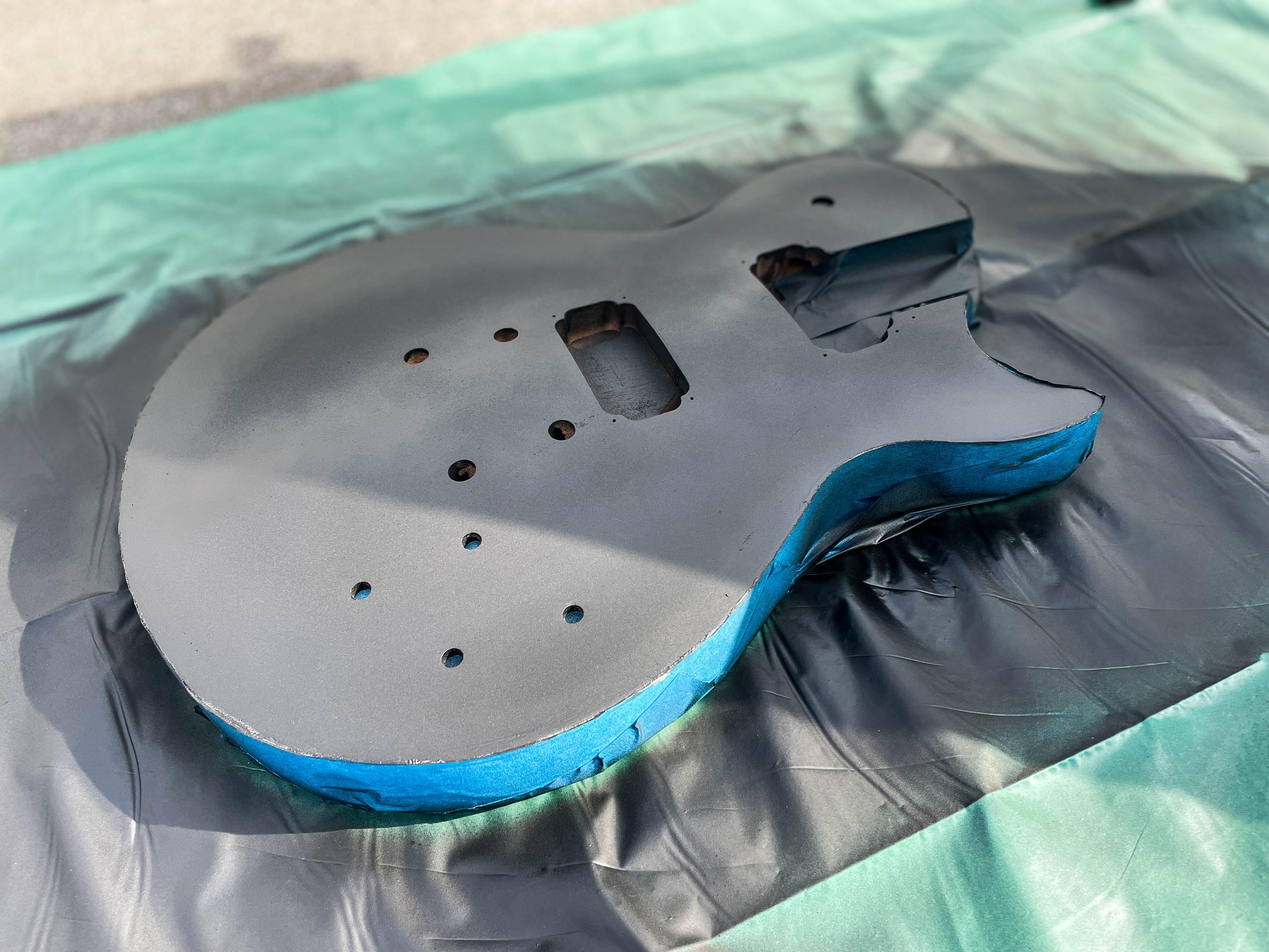 Guitar body spray-painted black